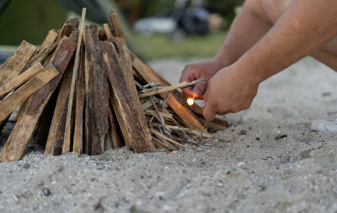 lighting a pile of sticks